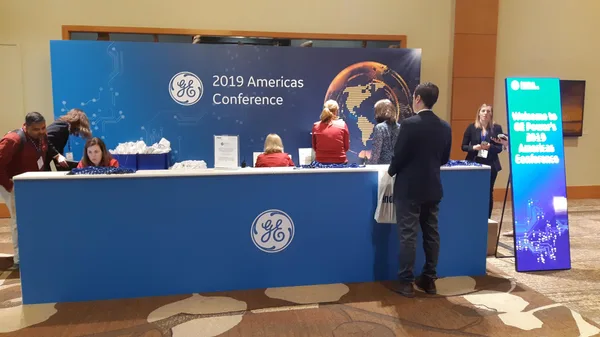 GE 2019 Americas Conference registration area with branded backdrop